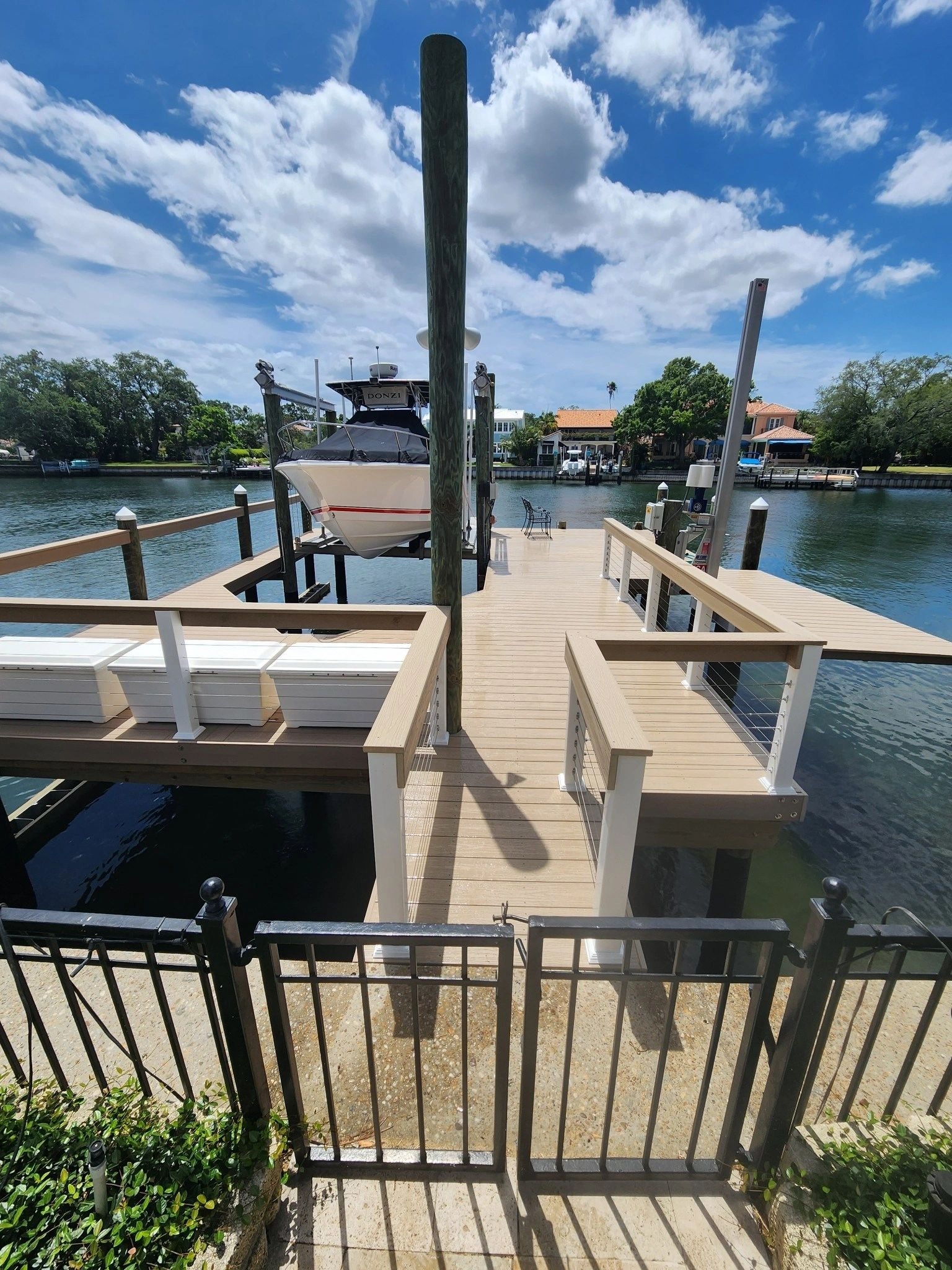 Wooden dock pilings along waterfront — March Marine Construction
